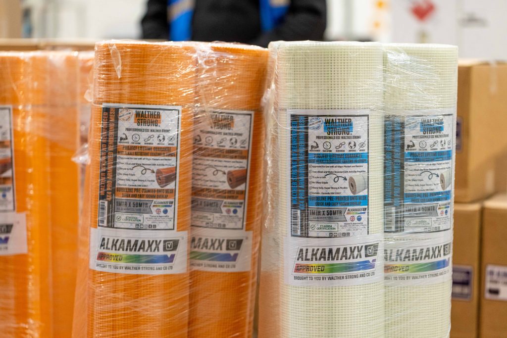 An image of wrapped render mesh in both orange and white colours.